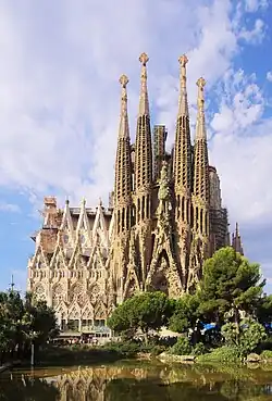 Photo of the Sagrada Família, a cathedral with tall, intricate towers and detailed facades
