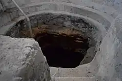 The water source of the bathhouse, as observed in July 2017, features steps along the edges of the spring. These steps were historically used for sitting and leaning by those utilizing the bath.