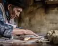 Dough for muéganos being rolled by a traditional artisan in Chiautempan, Tlaxcala.