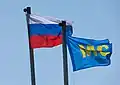 The Russian flag and the flag of the peacekeeping forces.