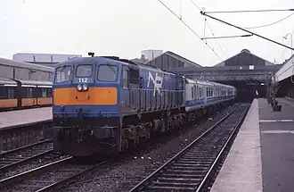 The Enterprise train being run by NI Railways branded coaches 19 October 1985, 10:57