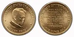 A gold medallion depicting a man and text