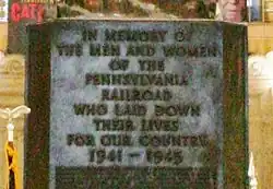 Inscription on the front of the monument; another is on the back.