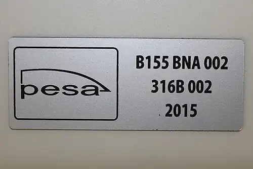 Pesa builder's plate on a Koleje Mazowieckie 316B series bilevel railcar