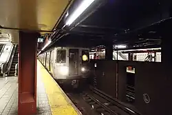 A "D" train arriving on the Sixth Avenue Line express tracks