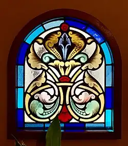 Romanian Revival acanthuses on a stained-glass window of the Kiseleff Roadside Buffet [ro] (Șoseaua Kiseleff no. 4), Bucharest, Romania, by Ion Mincu, 1889-1892[19]