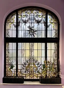 Rococo Revival festoon on a stained-glass window in the orangery of the Ecaterina Procopie House (Strada Bocșa no. 4), Bucharest, unknown architect or painter, c.1912[16]