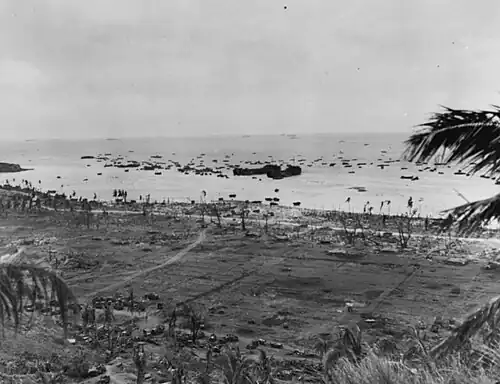 Scene on the Northern Beaches, near Asan Point, 21 July 1944, with two LSTs unloading