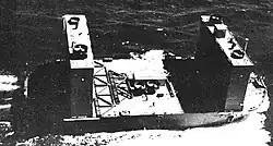 One Advance Base Sectional Dock (ABSD) section under tow with float wings up in 1944