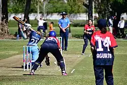 Lucia Taylor batting.