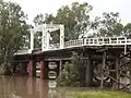 Old North Bourke bridge, in flood, northern side, North Bourke (2021).