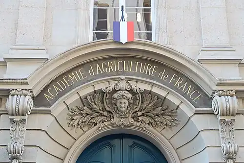 Beaux Arts cartouche with a mascaron, above the entrance door of the Académie d'Agriculture de France, Paris, unknown architect, 1878[11]