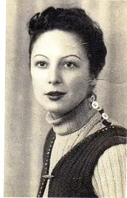 Portrait photograph of Ada Martí, wearing a sweater and short dark hair