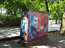 Utility box art stencil in tribute to Ahmed Merabet, killed in the Charlie Hebdo shooting, Paris