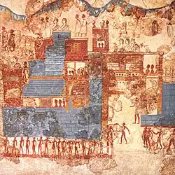 Ancient wall painting showing buildings and people