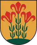 A coat of arms depicting three flowers that have red petals, green stalks, and green leaves all sprouting from green earth