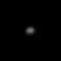 A blurry ellipsoidal object in the center of the image