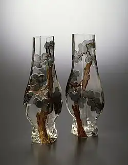 Rousseau-designed pair of pine tree vases (1878–84) Rousseau has adopted the cameo technique found in 18th-century Chinese glass. The Japanese-inspired pine tree designs have been created by cutting away portions of the surface of the glass to reveal the different colours within. Walters Art Museum