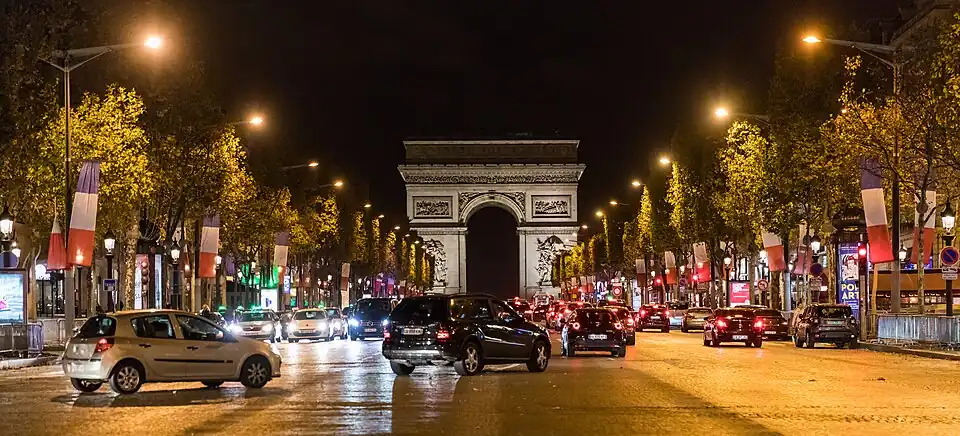 View of the Avenue des Champs-Elysées at night.