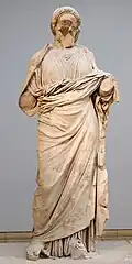 Statue usually identified as Artemisia; reconstruction of the Amazonomachy can be seen in the left background. British Museum Room 21