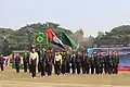 College Prefect along with College Flag Bearer standing in front of the Athletes Contingent of Khalid House