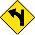 (W2-16) Side road intersection, entering straight ahead on a curve to left