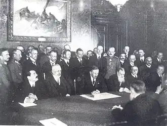 Picture taken at the signing of the Peace treaty with Romania (7 May 1918). Vasil Radoslavov is fourth from the left, sitting
