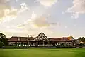 Back of the clubhouse from the practice putting green.