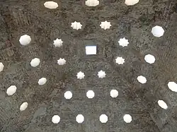 The vaulted ceiling of the warm room and its skylights