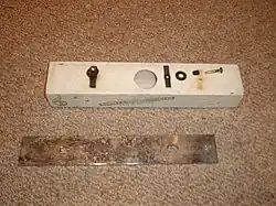 The same chime disassembled to show the resonator and mounting