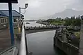The swing bridge begins to open as a barge approaches the Bonneville Navigation Locks