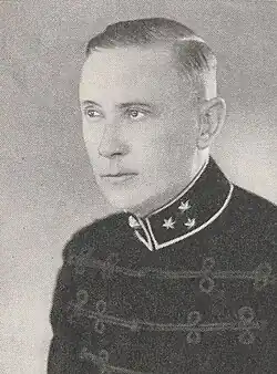 black and white portrait of a man in military-style uniform from the chest up, short light-coloured hair, no glasses