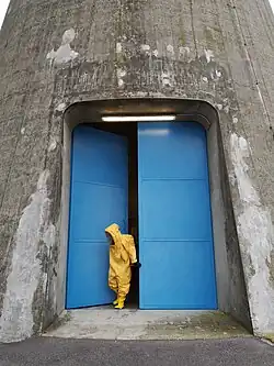 Door to chimney of the power station (behind-the-scenes image from the 'Hacking at Leaves' film shoot, 2020)