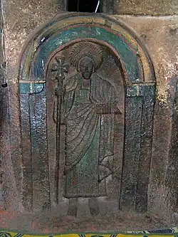 One of the seven life-size saints carved into the wall of the Church of Bet Golgotha, Lalibela, 15th century (traditionally believed to have been made during the reign of Gebre Mesqel Lalibela)[125]