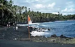 Kaimū Beach, also known as Black Sand Beach, 1959. Beginning in 1983, eruption from the Kīlauea volcano began to affect the area, completely covering it by 1990.