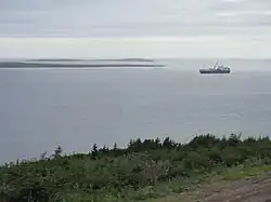 Blanc Sablon Bay, Green Island Cove and Green Island (51° 24′ 10.2″ N - 56° 34′ 36.1″ W) in background