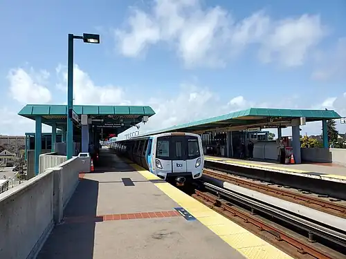 A metro train at an elevated train station