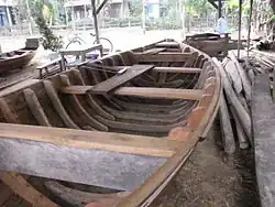 Boat nearing completion with frames added, Hội An
