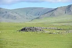 Bronze Age Khirigsuur burial mound in northern Mongolia near Jargalant