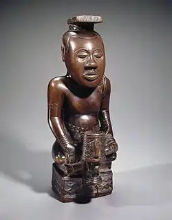 N'dop, king Mishe miShyaang maMbul; by artists of the Kuba Kingdom (Democratic Republic of the Congo); 18th century; wood; 49.5 cm; Brooklyn Museum, New York City[107]