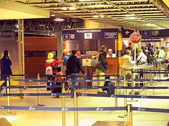 Juxtaposed immigration controls at Brussel-Zuid/Bruxelles-Midi railway station, with the Belgian Federal Police carrying out exit immigration checks from the Schengen Area in front, and the UK Border Force carrying UK entry immigration checks behind