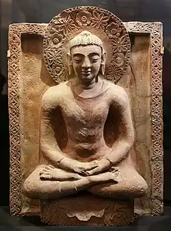 Buddha from the Kahu-Jo-Darro stupa at Mirpur Khas, Sindh, circa 410 CE. This is a conflation of the Greco-Buddhist art of Gandhara, and Gupta art.[81]