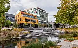 view of a river, a river terrace, and urban buildings