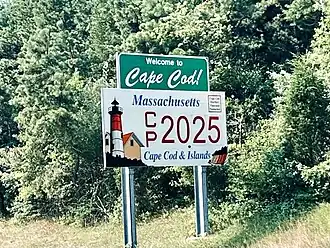 Cape Cod welcome sign, featuring the 2025 Cape Cod & Islands registration plate design