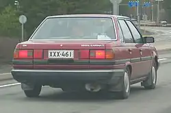 Carina II 1.6DX Sedan (Finland) rear view, showing placement of license plate
