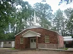 Carolina Baptist Church, with a companion cemetery, is located off Louisiana Highway 155 east of Saline.