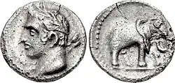 Image of both sides of a coin: one depicting a man's head; the other an elephant