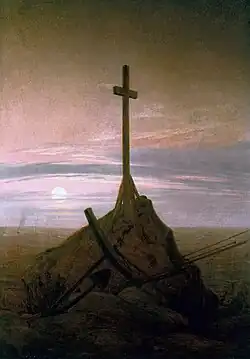 The Cross Beside The Baltic (1815), 45 × 33.5 cm. Schloss Charlottenburg, Berlin. This painting marked a move away from depictions in broad daylight, to return to nocturnal scenes, twilight and a deeper poignancy of mood.[93]