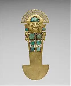 Ceremonial knife/tumi (Sican); 10th–13th century; gold, turquoise, greenstone and shell; height: 33 cm; Metropolitan Museum of Art[73]