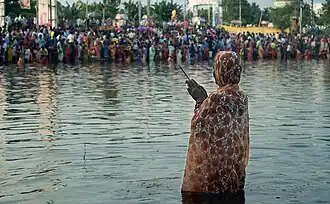 Woman praying during Chhath
